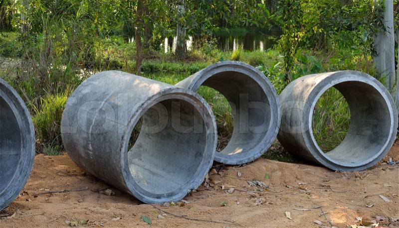 Concrete sewage pipes under construction, stock photo