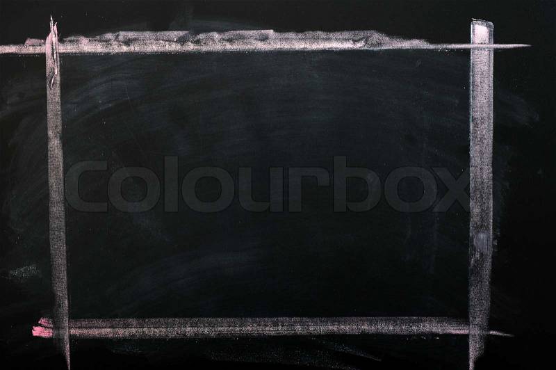 Smudged chalkboard background with a chalk drawing frame, stock photo
