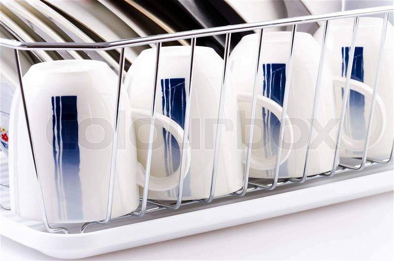 Dishes rack on isolated white background, stock photo