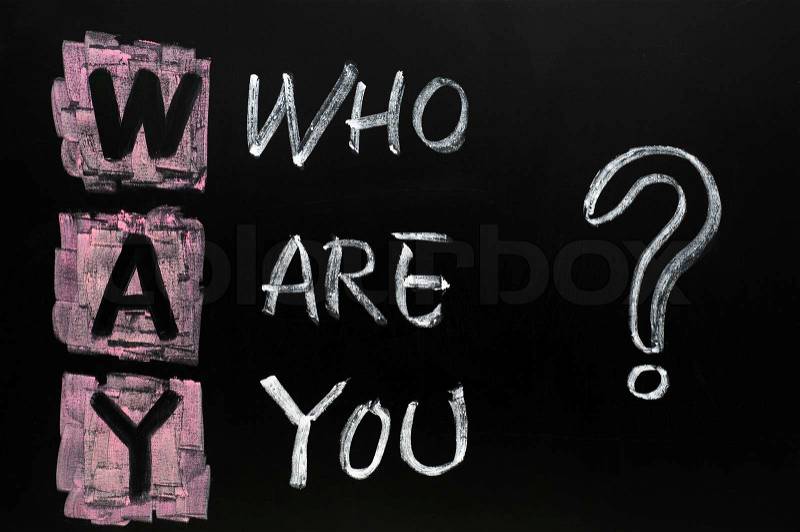Philosophy question of who are you written in chalk on blackboard, stock photo