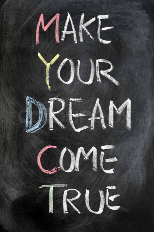 Make your dream come true written on blackboard, stock photo