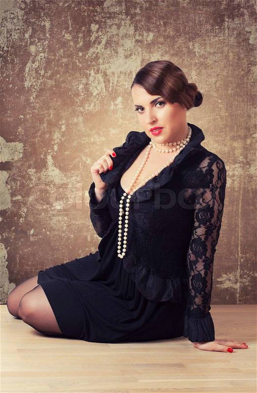 Portrait of retro woman with pearls, stock photo