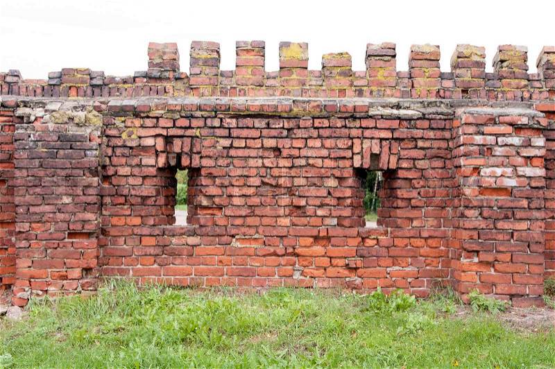Element of a brick wall of defensive installations, stock photo