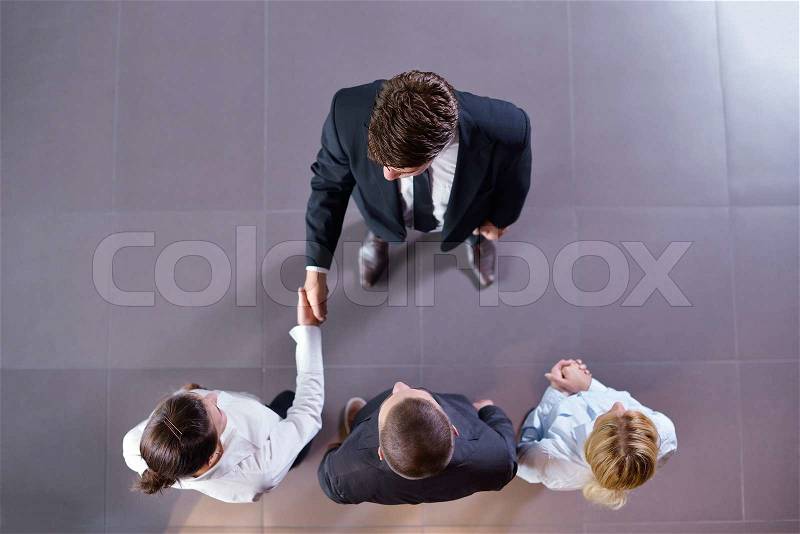 Business people shaking hands make deal and sign contract, stock photo