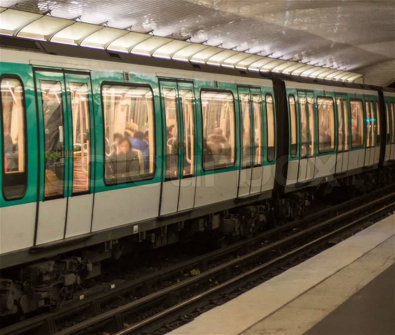 Paris Metro. Green and white train in the subway station, stock photo