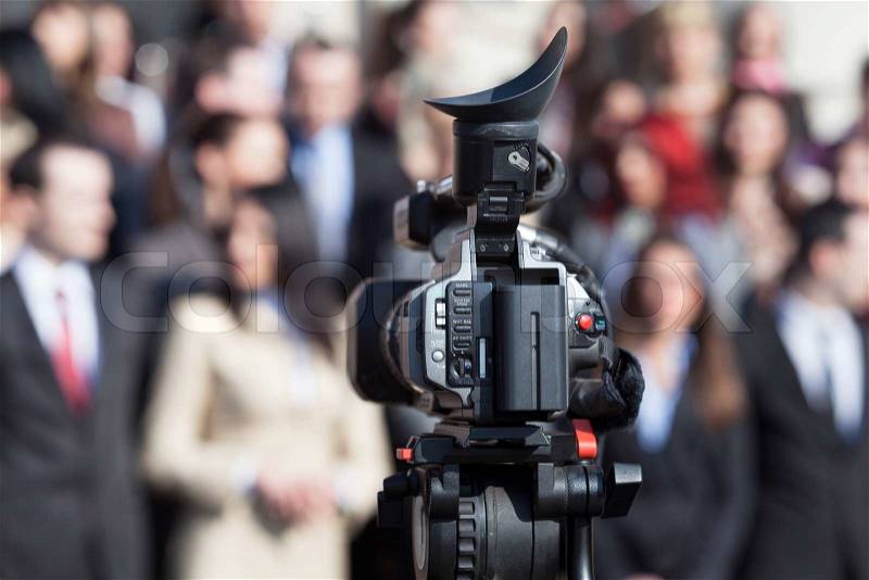 Capturing event with professional video camera, stock photo