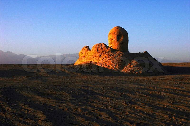Relics of an ancient castle named Milan in the desert of Sinkiang at sunrise, stock photo