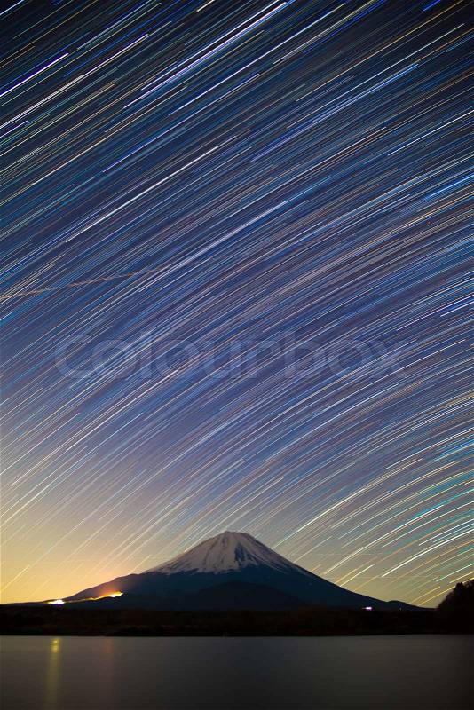 Mount Fuji, Lake Shojiko and star trails of winter stars, stock photo