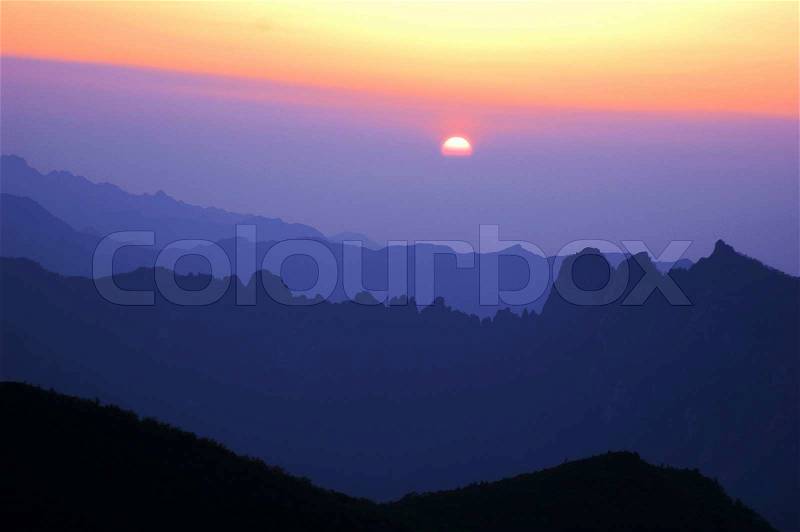 Landscape of sunrise on the top of mountains, stock photo