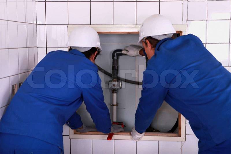 Installation of plumbing, stock photo