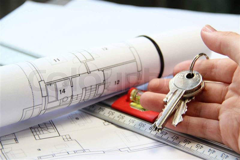 Architecture project on the office table with tools and keys, stock photo
