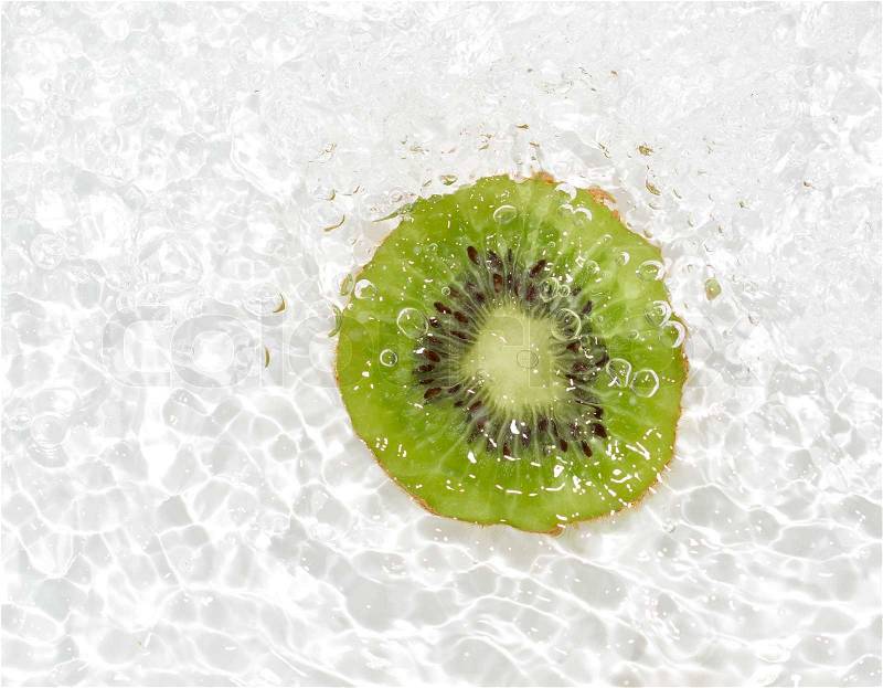 Juicy kiwi fruit in water on a white background. macro, stock photo