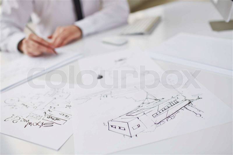 Image of sketches at workplace, stock photo