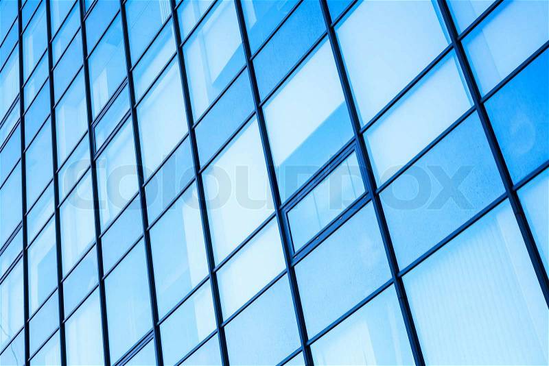 Moder office facade with blue shining glass ans steel frames, stock photo