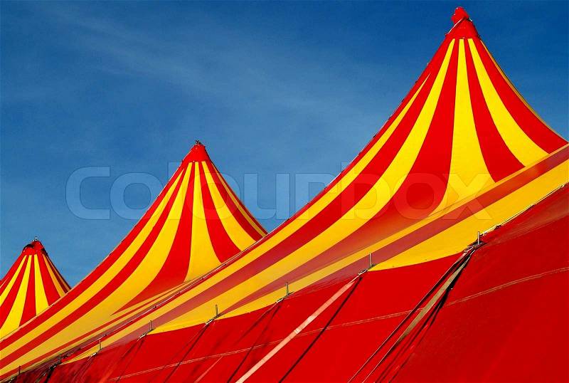 Circus tent top with yellow and red stripes, stock photo