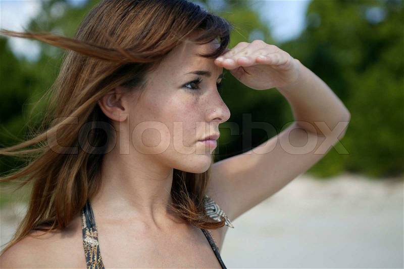 Woman looking into the distance, stock photo