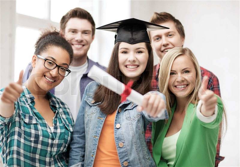 Education concept - happy girl in graduation cap with diploma and students, stock photo