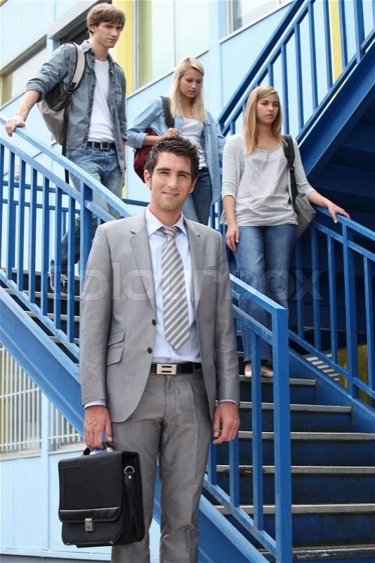 Students and teacher on stairs, stock photo