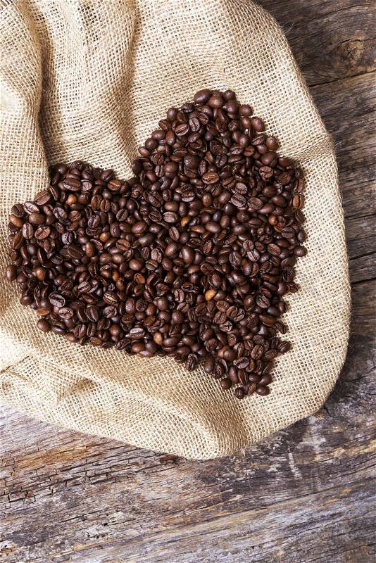 Coffee Heart. Large Heart Shape on Canvas Created From Coffee Beans, stock photo