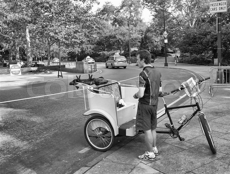 NEW YORK CITY - SEP 30: Unidentified pedicab driver awaits next customer in Central Park on September 30, 2006. Pedicab is an eccentric yet very traditional in perspective of touring New York, stock photo
