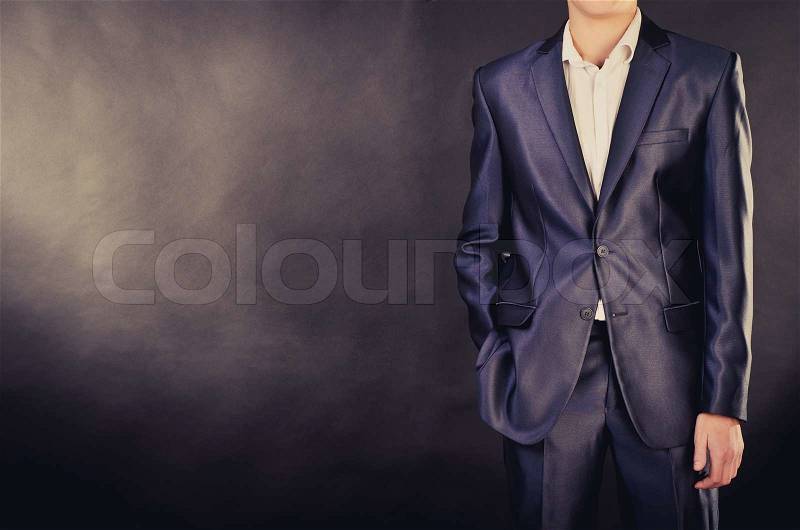 Man in suit on a black background, stock photo