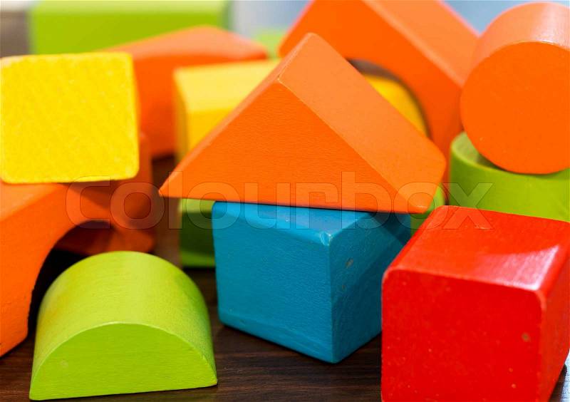Colorful wooden toy building blocks, stock photo