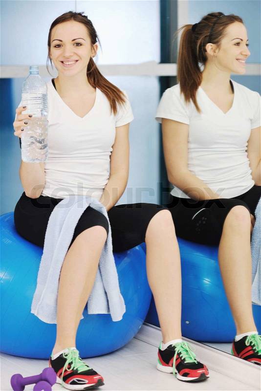 Young woman drink water at fitness workout training at sport club, stock photo