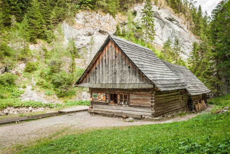 Wooden cottage in the mountains, stock photo