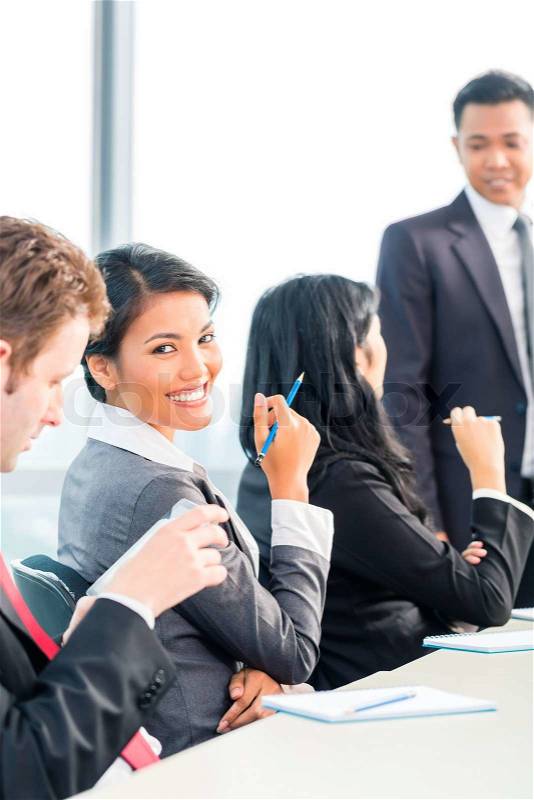 Asian Businesspeople in office team meeting, stock photo