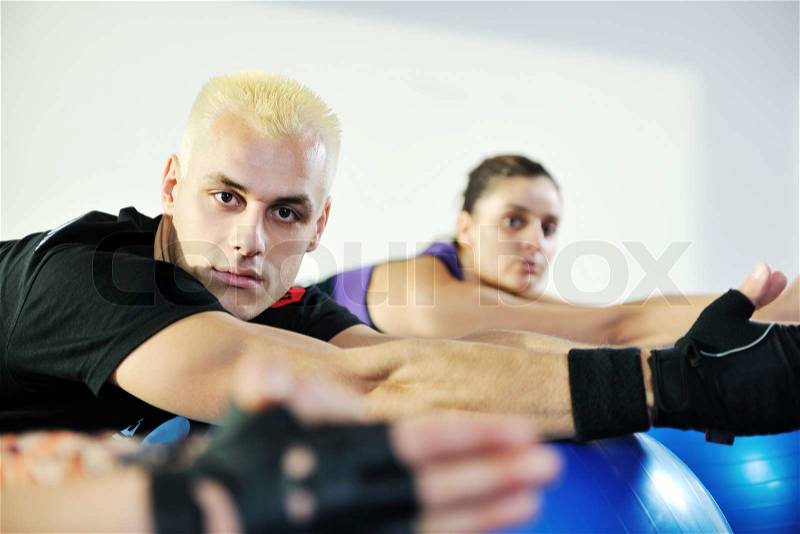 Man fitness personal trainer in sport club, stock photo