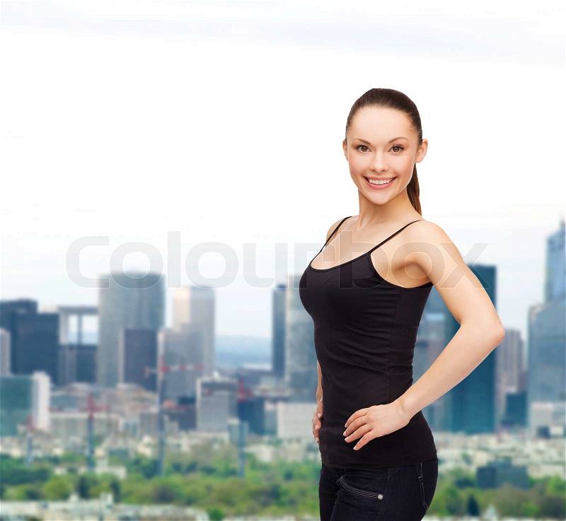 Shirt design concept - smiling woman in blank black shirt, stock photo