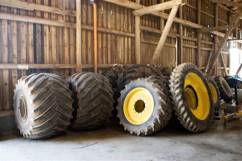 Tractor tires inside a barn, stock photo