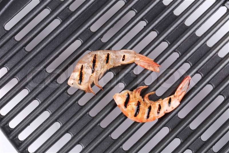 Grilled shrimps on grill. Close up. Whole background, stock photo