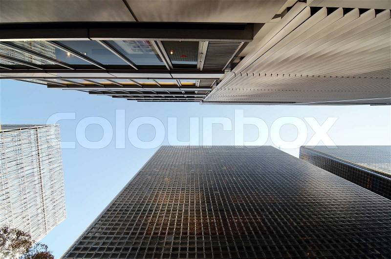 Worm eye view of modern building glass block wall , stock photo