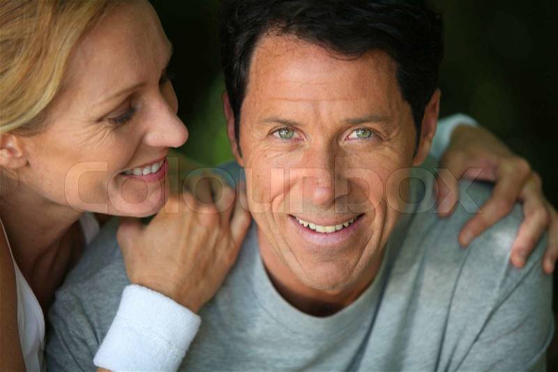 Middle-aged couple smiling, stock photo