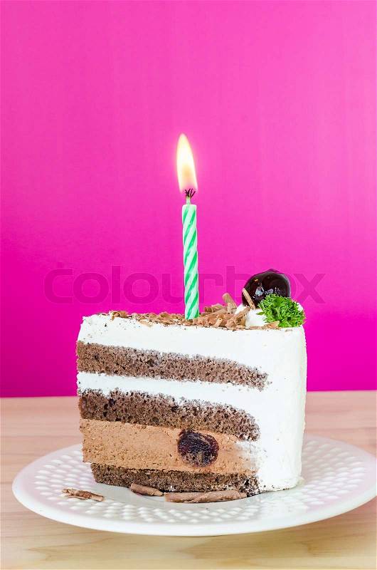 Chocolate cake with black cherry in white dish&colorful background, stock photo