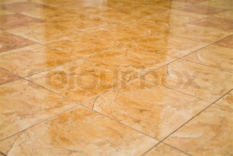 Glazed tile on the floor as a background, stock photo