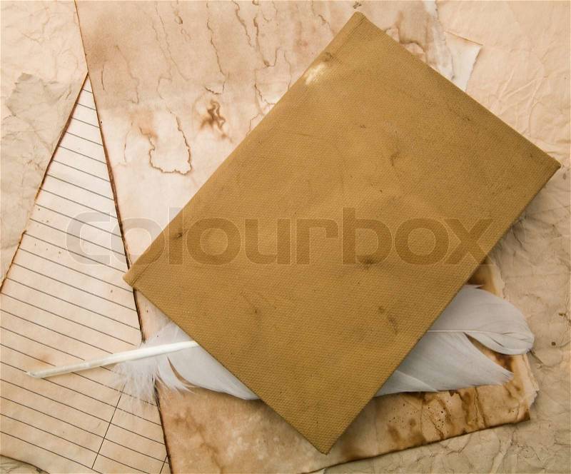 Feather and old paper for a letter , stock photo