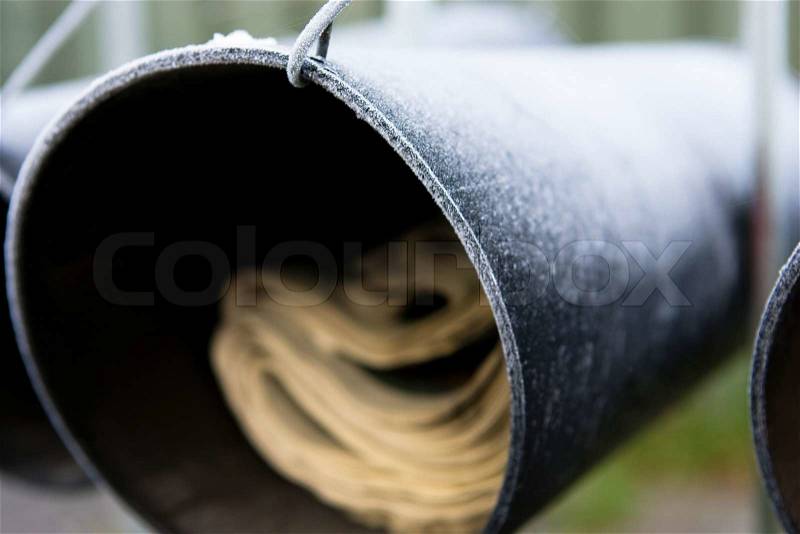Close up image of a frosty letter box with newspaper, stock photo