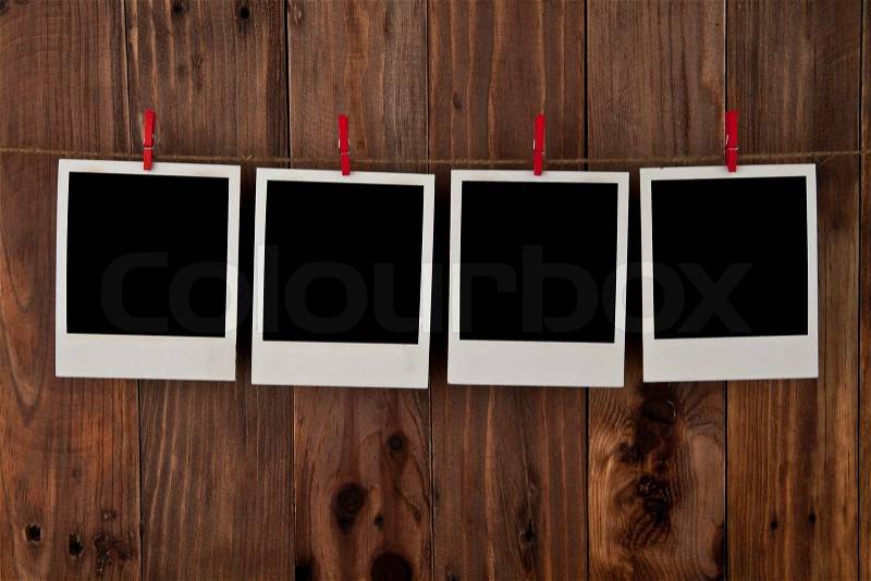 Old pictures on a wooden background, stock photo