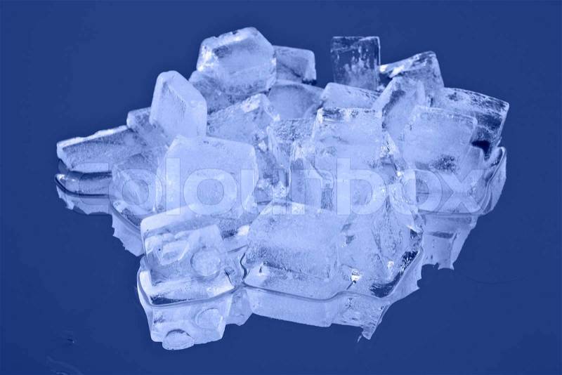 Blocks of ice on a blue background, stock photo