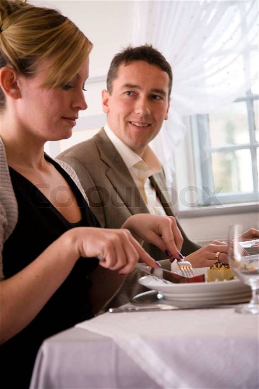 A caucasian couple on a dinner date, stock photo