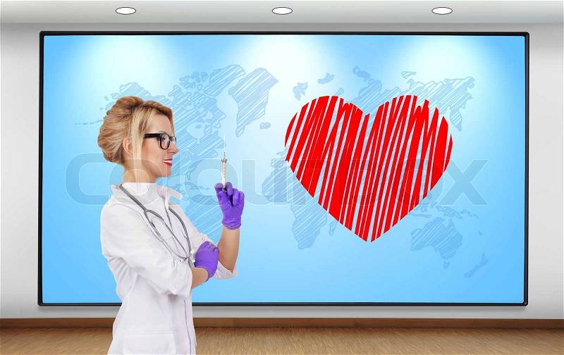Female doctor with syringe and heart symbol on plasma panel, stock photo