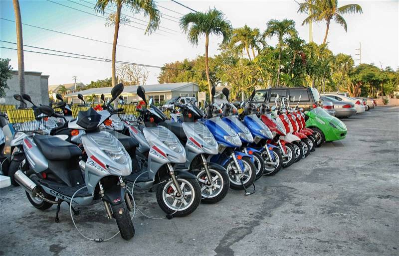 KEY WEST - FLORIDA - JAN 7: Motorbikes ready for touristic rental, January 7, 2009 in Key West, Florida. More than 3 million people visit Florida Keys every year, stock photo
