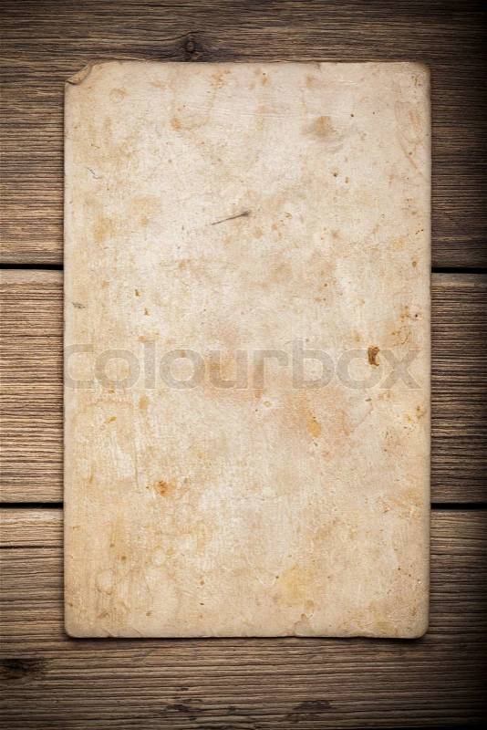 Old paper on the wood background, stock photo