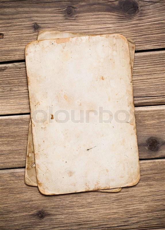 Old paper on the wood background, stock photo