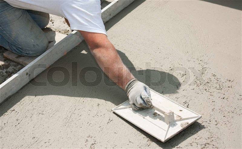 Mason building a screed coat cement, stock photo