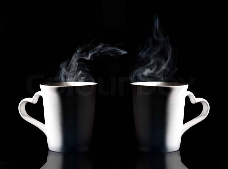 Coffee cup with smoke isolated black background, stock photo