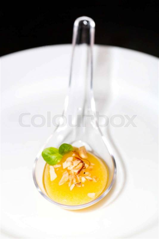 Molecular Cuisine mango jelly on white background, stock photo
