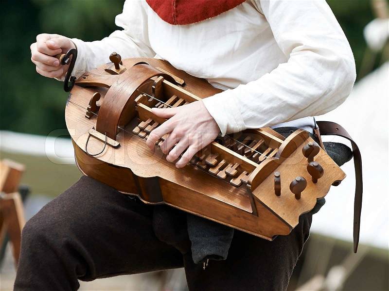 Person playing the instrument Hurdy gurdy, stock photo